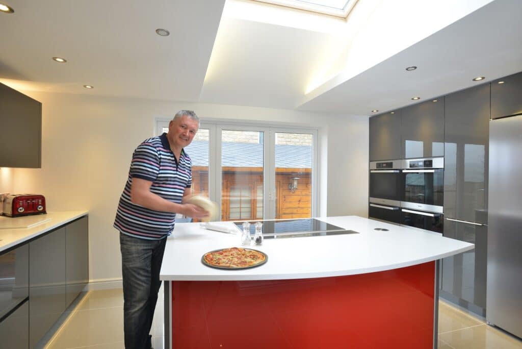 Mr & Mrs Driver - Gloss lacquered kitchen dressed with Bright Red Glass