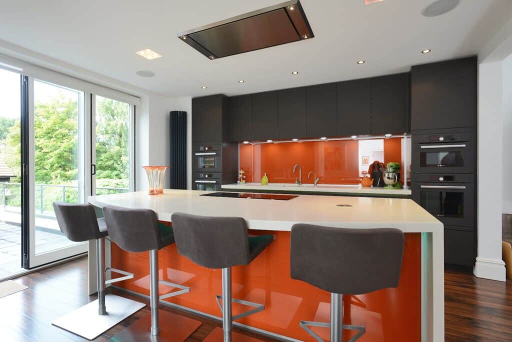 Mr & Mrs Jacobson - AWARD WINNER DECEMBER 2012 - Satin glass Kitchen in Terra brown matt glass & Corian worktops