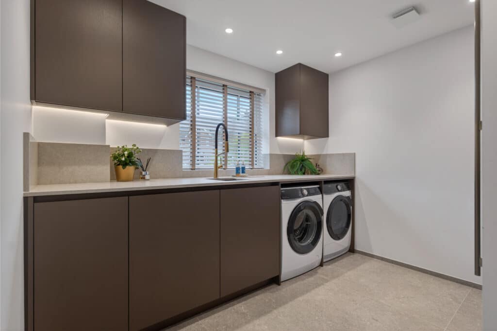 A stunning Eggersmann kitchen combining Bronze and Champagne metallic cupboards and  Quartz worktops, Siemens appliances and Crittall doors.